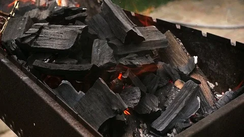 Slow motion footage of burning wood in barbeque at backyard Stock Footage