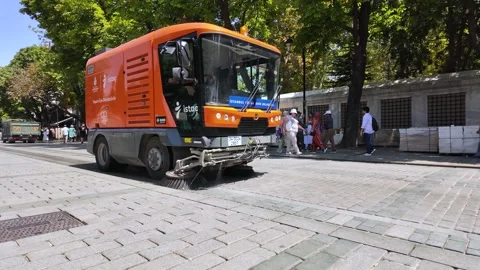 Slow motion footage of a communal worker cleaning the street Stock Footage 296499156