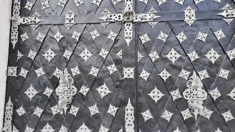 Slow motion footage of the detailed texture of medieval style forged metal gates Stock Footage 344430672
