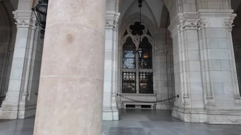 Slow motion footage of gothic windows and arcade columns on Vienna City Hall Stock Footage 344432807