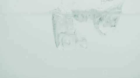 Slow motion footage of ice falling into the water Stock Footage 68841266