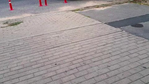 Slow motion footage of the interlock bricks of the pavement. Street Stock Footage 286700479