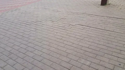 Slow motion footage of the interlock bricks of the pavement. Street Stock Footage 286700907