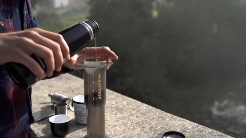 Slow motion footage of a Man making coffee In Camping Stock Footage 129767297