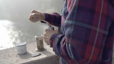Slow motion footage of a Man making coffee In Camping Stock Footage 129767300