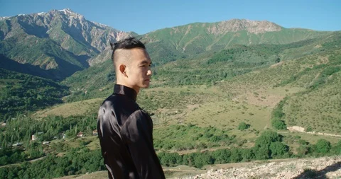 Slow motion footage of a man practicing martial arts. Bright emotions on his Video stock 115883633
