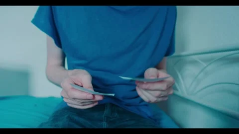 Slow Motion Footage of Man Reading Notes and then Crumples them up in Anger Stock Footage 341527446