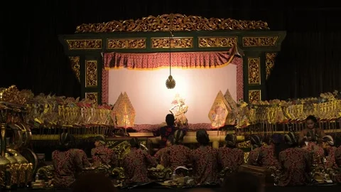 Slow motion footage of a shadow puppet performance originating from Javanese 動画素材 331754980