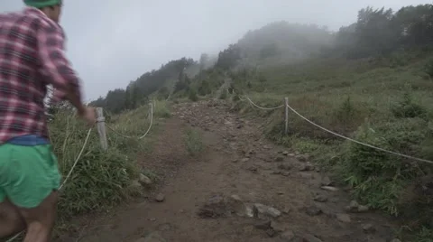 Slow motion footage of trail runner at Mount Daibosatsu in summer, Yamanashi Stock Footage 58467400