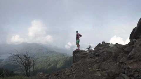 Slow motion footage of trail runner relaxing at Mount Daibosatsu in summer, Stock Footage 58467506