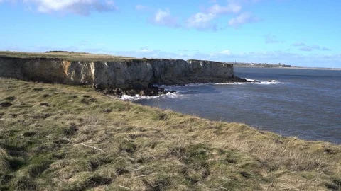 Slow Motion footage of waves hitting South Shields coastline/cliffs. Stock Footage