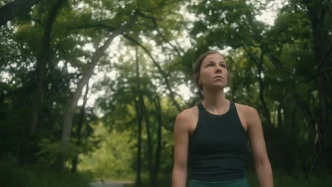 Slow Motion Footage of Young, Athletic Woman Walking Through Forest Stock Footage 242444344
