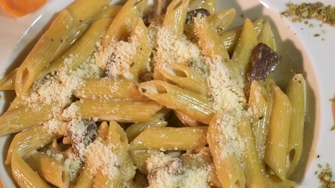 Slow motion fork going to pasta plate. Pasta Penne with Tomato Bolognese Sauce Video stock 86862822