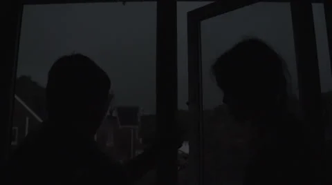 Slow Motion Fork Lightning As Children Watch Video stock 60237229