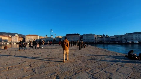 Slow motion forward moving on pier with people walking Stock Footage 122364639
