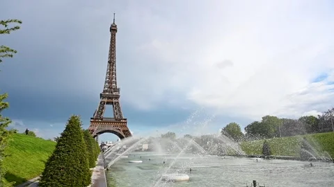 Slow motion of fountain in front of Eiffel tower in Paris, France. Stock Footage 243585619