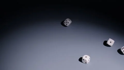 Slow-motion of Four Dice Rolling into Frame from Right and Stopping Stock Footage 323820719