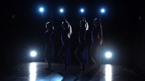 Slow motion of four experienced charming ballerinas dancing modern ballet. Stock Footage 111307873