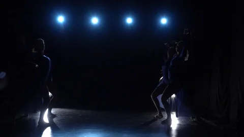 Slow motion of four experienced graceful ballerinas dancing modern ballet. Stock Footage 111307509