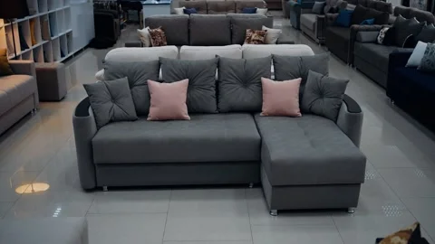Slow motion frame to a comfortable gray sofa with gray and beige pillows. Home Stock Footage 235057075