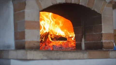 Slow motion frame as in a pizza oven, freshly baked firewood is burning. Place Video stock 127052594