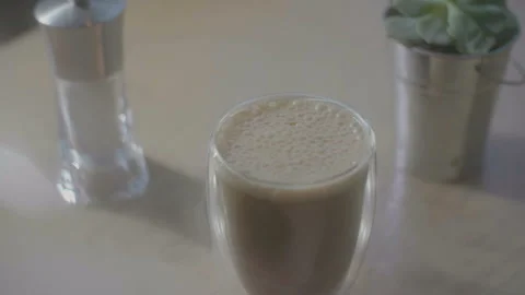 Slow-motion frame with smoke and cup of coffee on the table Stock Footage 100899861