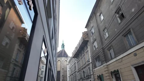 Slow motion framing the historic Kirche am Hof dome from Steindlgasse in Vienna Stock Footage 344428278