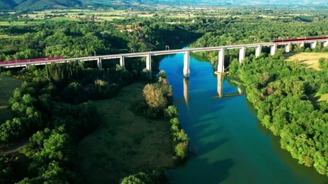 Slow motion Freccia Rossa Train versus Italo NtV above rail bridge same time 4K Stock Footage 196255804