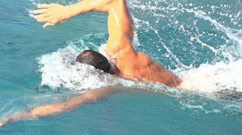 Slow motion freestyle swimming sideview Stock Footage 12027353