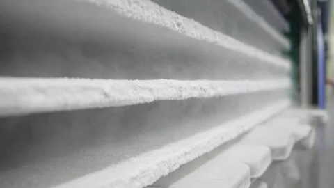 Slow motion: Freezer steam drips down frosty packages Vidéo 243310160
