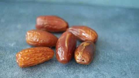 Slow motion of fresh date fruit dropping on a table Stock Footage 271018580