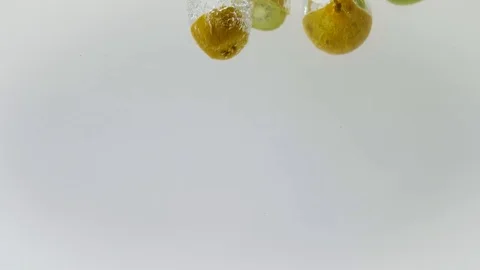 Slow motion fresh fruit fall  in water Stock Footage 125256801