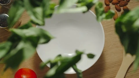 SLOW MOTION: Fresh Green Basil Leaves Pouring On A Table Stock Footage 118788859