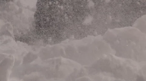 Slow motion: Fresh snow sparkles in the sun in front of a snow shovel.. Stock Footage 47340686