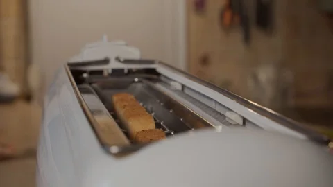 Slow motion, fried bread popping out of a toaster. Closeup. Move camera Video stock 119539721