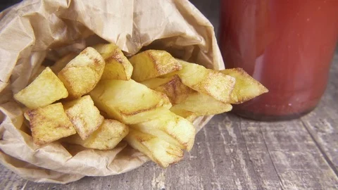 Slow motion fried potatoes sprinkled with a mixture of pepper Stock Footage 96211027