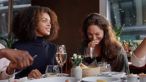 Slow motion of friends enjoying dinner Stock Footage 159581373