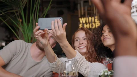 Slow motion of friends taking selfie in bar Stock Footage 159577603