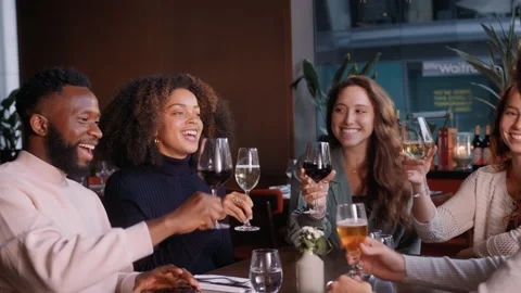 Slow motion of friends toasting in wine bar Stock Footage 159579687