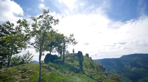 Slow motion of friends on the top of a mountain panorama pan Stock Footage 58614031