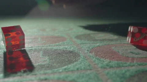 Slow motion front close-up red dices on gaming table 库存影片 335699940