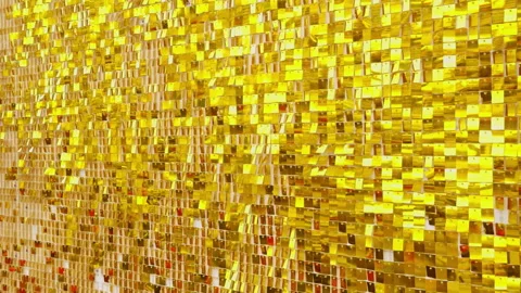 Slow Motion Front View of Gold Sequin Surface with Reflective Tiles Fluttering a Stock Footage 323677247
