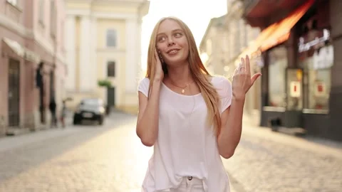 Slow motion front view of a Young beautiful blonde woman in stylish clothes Stock Footage 141686719
