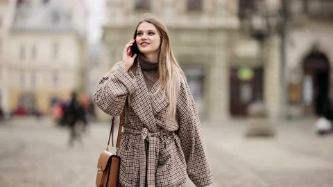 Slow motion front view of a Young beautiful blonde woman in stylish clothes Stock Footage 151858286