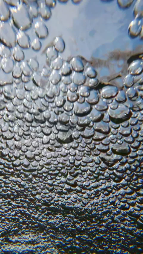 Slow motion: frothy, high-speed surge of bubbling aerated surface of water, Stock Footage 338133410