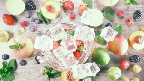 Slow motion fruit drink with ice top view Stock Footage 93198606