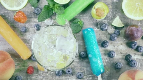 Slow motion fruit drink with ice top view Stock Footage 93200563