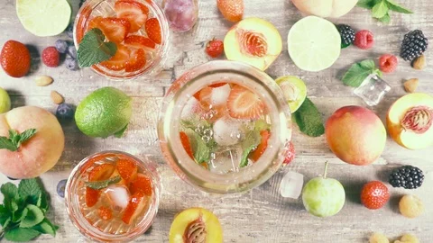Slow motion fruit drink with ice in a glass top view Stock Footage 93239881