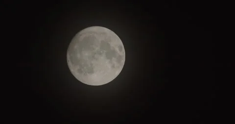 Slow motion full moon over dark summer sky 4K video Stock Footage 248324883