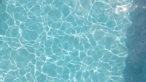 Slow motion fun man jumping in swimming pool at luxury hotel resort Stock Footage 137790006